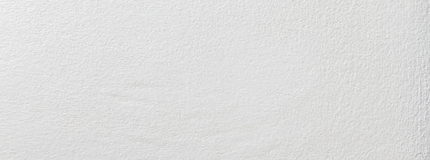 istock White color with an old grunge wall concrete texture as a background. Wide banner 1389113021