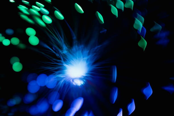 abstract blue on black bokeh background overlay layer. sparks and blowing. festive background. Sparkling magical dust particles.