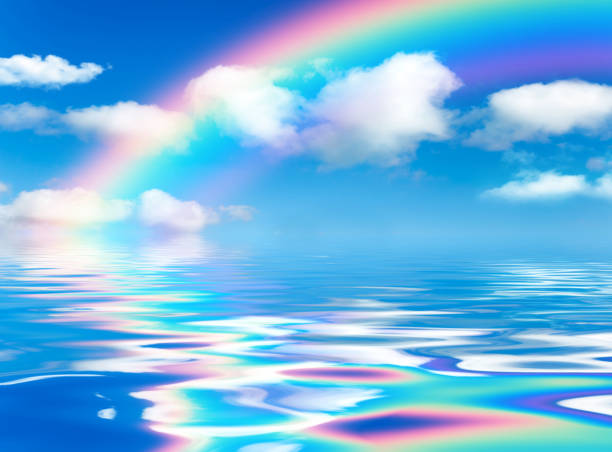 istock Sunny day background, blue sky with white cumulus clouds and rainbow 1389121006