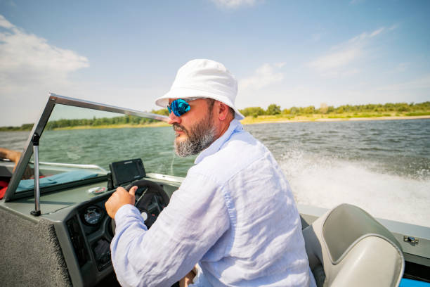 istock Young man riding the speedboat 1389123957