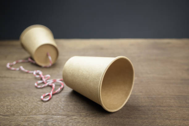 istock Old style paper cup phone 1389124877
