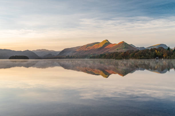 istock Catbells Mountain Range Reflecting In Lake. Derwentwater, Lake District, UK. 1389125830