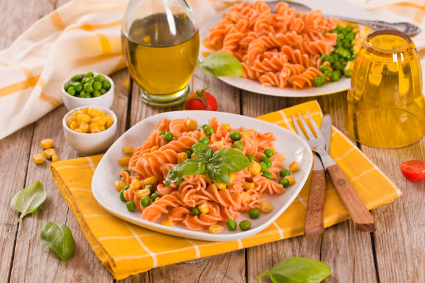 istock Fusilli pasta with peas and sweet corn. 1389126982