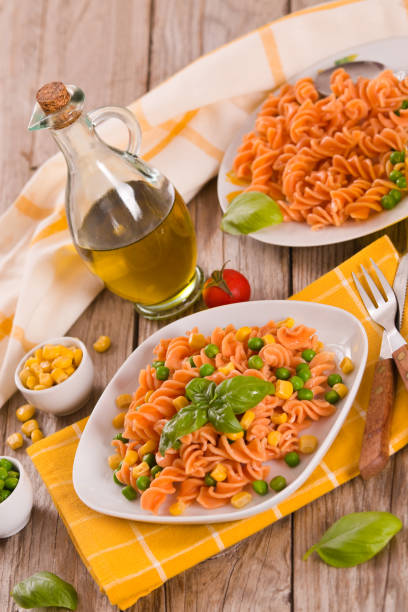 istock Fusilli pasta with peas and sweet corn. 1389128173