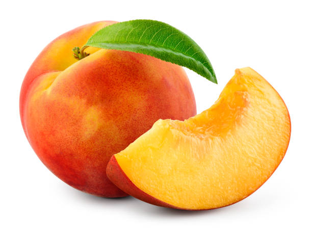istock Peach isolated. Whole peach with slice on white background. Peach fruit with leaf cut out. With clipping path. Full depth of field. 1389128300