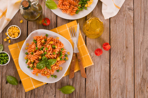 istock Fusilli pasta with peas and sweet corn. 1389129404