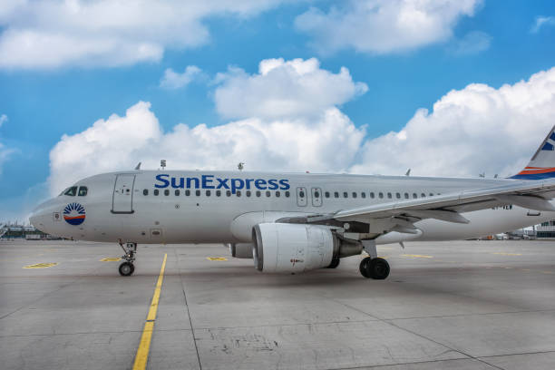 A big SunExpress aircraft. A big SunExpress aircraft is getting ready for boarding at the airport in summer: Munich, Germany - September 15, 2018 sunexpress stock pictures, royalty-free photos & images