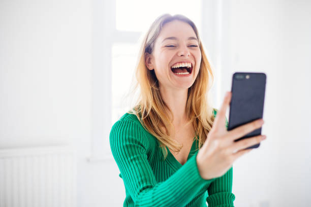 istock Woman on video calling by phone 1389130617