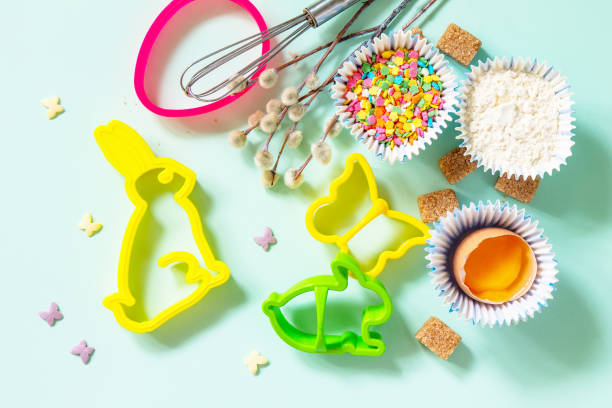 istock Baking or cooking background. Ingredients for Easter festive baking. Kitchen utensils, flour, brown sugar, eggs and butter on a light green background. Top view flat lay. 1389131470