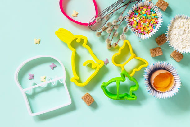 istock Baking or cooking background. Ingredients for Easter festive baking. Kitchen utensils, flour, brown sugar, eggs and butter on a light green background. Top view flat lay. 1389131475