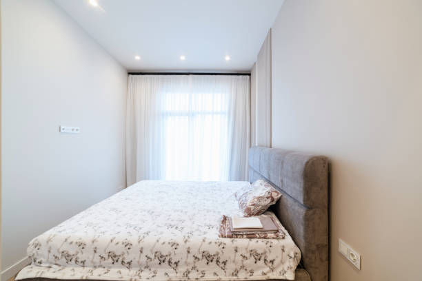 istock bright interior of a room with a large sleeping bed and a window 1389132950