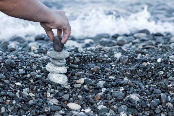 istock Spa Stones. Pyramid from nautical pebbles by the sea. 1389134183
