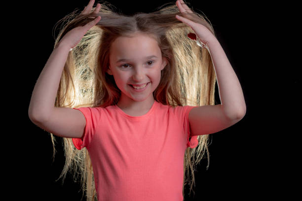 Girl holds her long hair