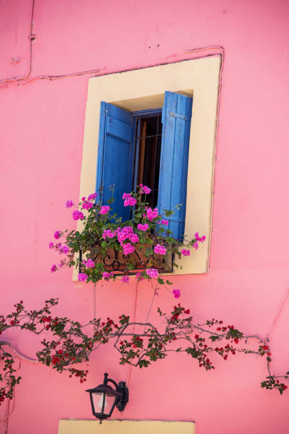 istock Magical view with a window in flowers and blinds in Greece 1389138112