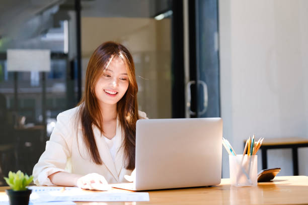 istock Businesswoman is working at office and using laptop. 1389140861