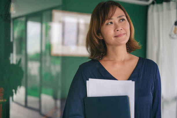 istock Business Woman Contemplating Her Future Project 1389141181