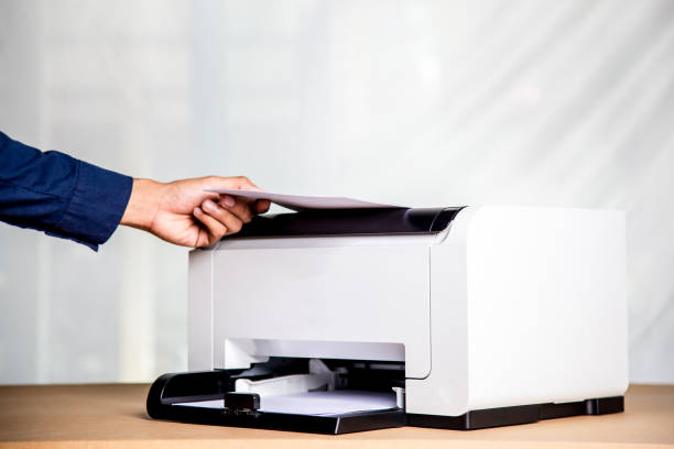 istock Printer, copier, scanner in office. Workplace ,photocopier machine for scanning document printing a sheet paper and xerox photocopy. 1389142170