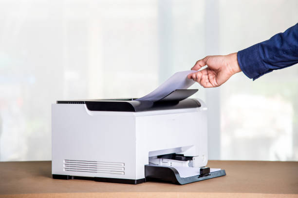 istock Printer, copier, scanner in office. Workplace ,photocopier machine for scanning document printing a sheet paper and xerox photocopy. 1389142184