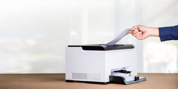 istock Printer, copier, scanner in office. Workplace ,photocopier machine for scanning document printing a sheet paper and xerox photocopy. 1389142185