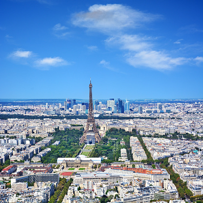 Aerial view of Paris with Champ-de-Mars, Eiffel Tower and skyscrapers of La Defense