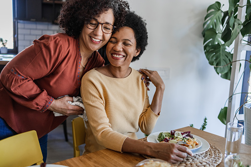 Two lesbian women having good time together during dinner.