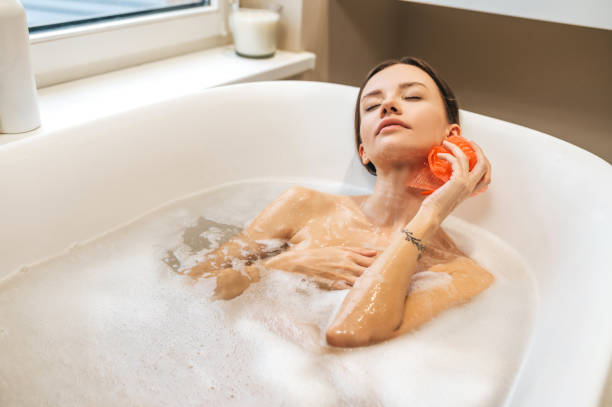 istock Peaceful young woman soaking in the bath 1389142523