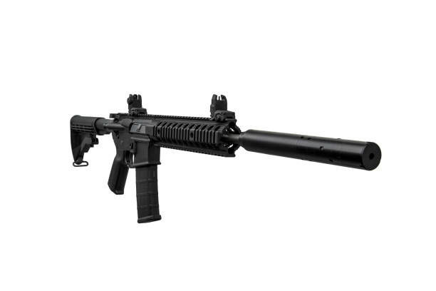istock Modern automatic rifle isolated on black background. Weapons for police, special forces and the army. A carbine with mechanical sights and a silencer on a dark background. 1389142701