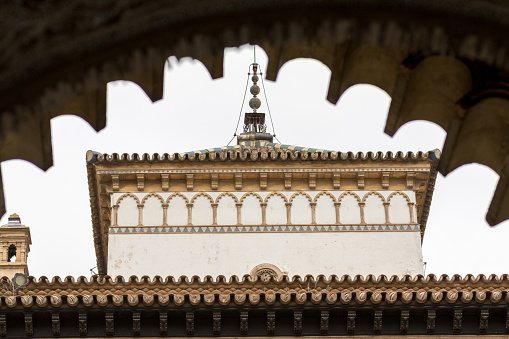 Seville, Spain - May 10, 2018: Finely chiseled and decorated wall of the Alcazar Seville building