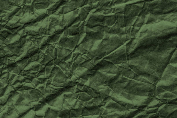 istock Crumpled paper green texture. 1389145216