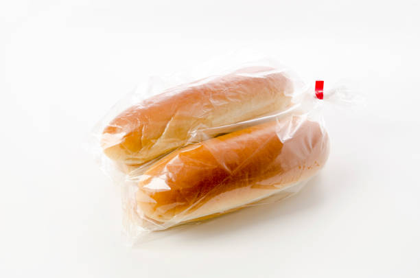 istock Hot dog bun in plastic bag on white background 1389146061