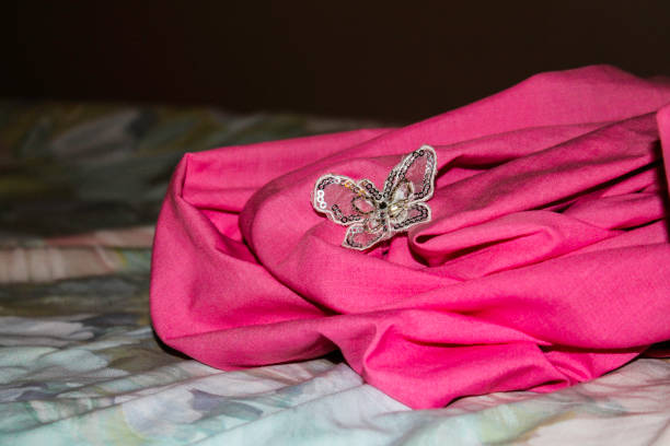 Butterfly hairpin on pink fabric