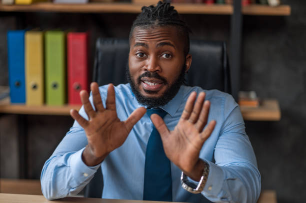 istock Scared company employee pushing someone away from him 1389146293