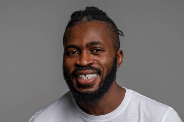 istock Smiling male posing for the camera against the gray background 1389146305