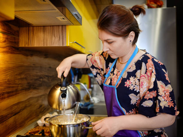 Woman preparing choux pastry stock photo