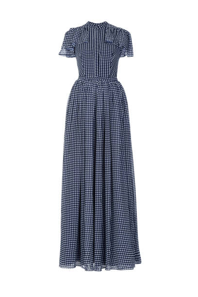 Long summer silk dress with polka dots on a white background.