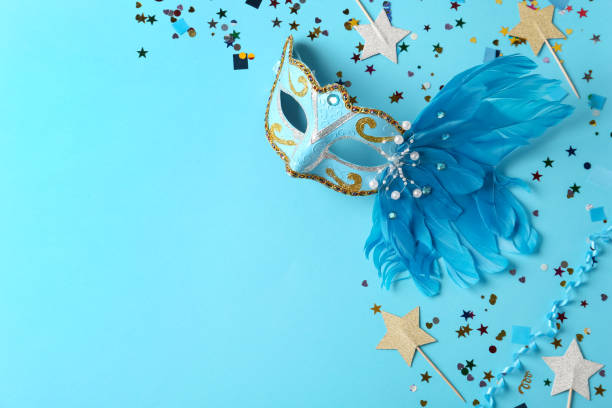 istock Beautiful carnival mask with decor on light blue background, flat lay. Space for text 1389150024