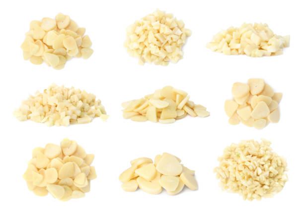 istock Set of cut garlic on white background 1389150355