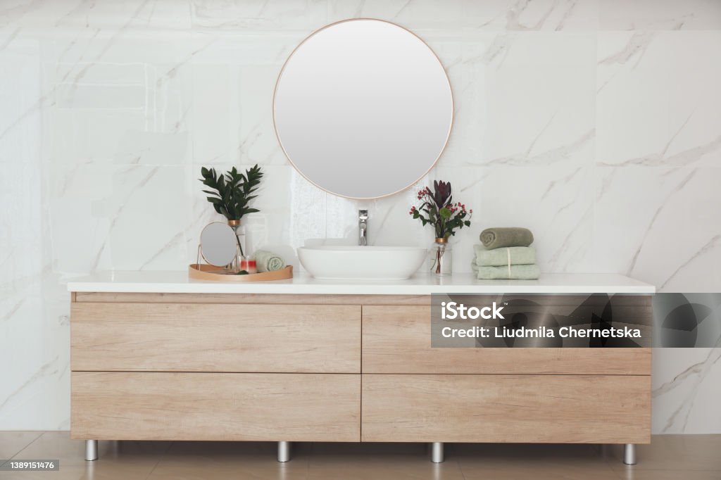 Modern bathroom interior with stylish mirror and vessel sink Bathroom Stock Photo