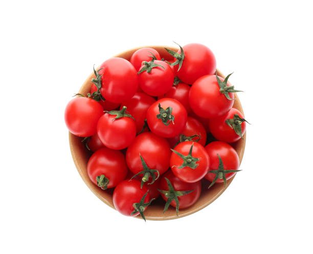 istock Fresh ripe cherry tomatoes in bowl on white background, top view 1389151479