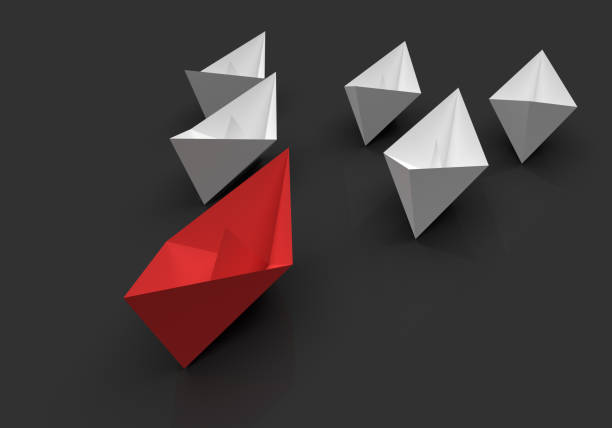 istock Leadership and business concept. One red leader ship leads other ships forward 1389152018