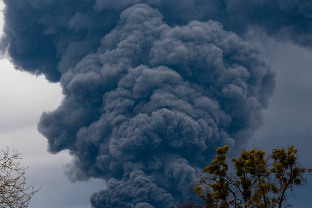 istock Thick black smoke covers the sky during the war between Ukraine and Russia 1389158218