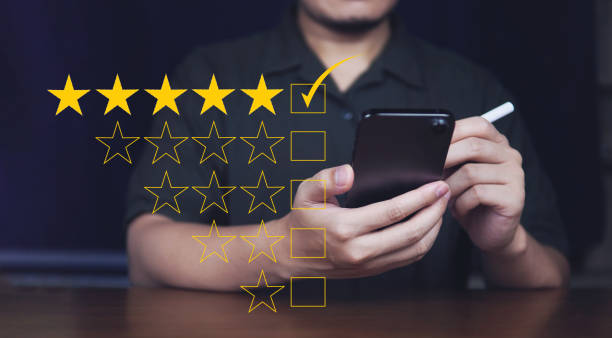 istock Customer review good rating concept hand pressing five star on visual screen and positive customer feedback testimonial 1389159318