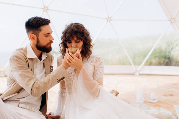 istock Tea ceremony at a boho wedding. Bride and groom in boho. 1389161713