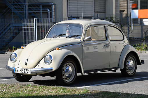 Radolfzell, Germany, March 27, 2022 - An old beige Volkswagen beetle (VW 1200 A) from 1972