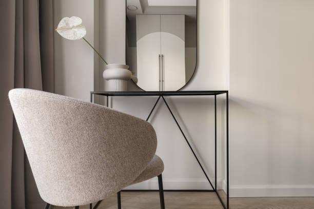 istock Single white Anthurium flower in ceramic vase on metal black console table in bedroom interior. Modern interior decoration concept. 1389162652