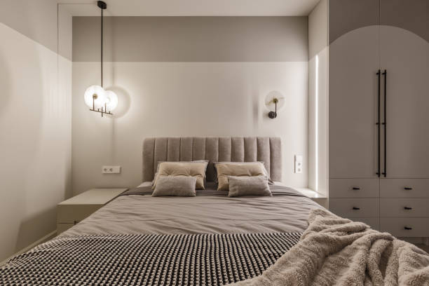 istock Modern bedroom interior in pastel colours. Trendy minimalistic interior concept 1389162677