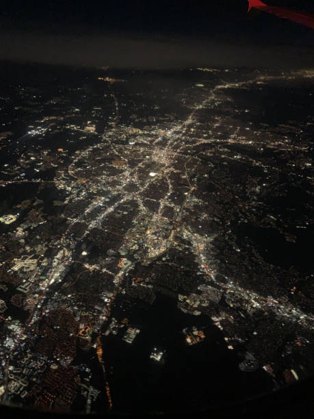 istock Flying over a city at night 1389162798