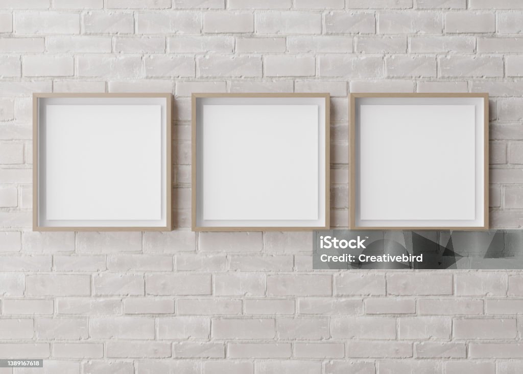 Three blank square picture frames hanging on white brick wall. Template, mock up for your picture or poster. Copy space. 3D rendering. Three blank square picture frames hanging on white brick wall. Template, mock up for your picture or poster. Copy space. 3D rendering Picture Frame Stock Photo