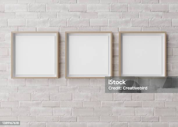 Three Blank Square Picture Frames Hanging On White Brick Wall Template Mock Up For Your Picture Or Poster Copy Space 3d Rendering Stock Photo - Download Image Now