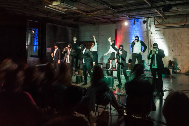istock Large group of theater actor artists perform play for audience 1389167838